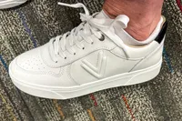 A side view of a person wearing the Vionic Women's Kimmie Court Sneakers