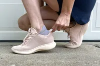 A side view of a person wearing the Vivaia Unisex Urban Sneaker Sliders