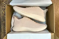 A pair of Vivaia Unisex Urban Sneaker Sliders in a shoebox