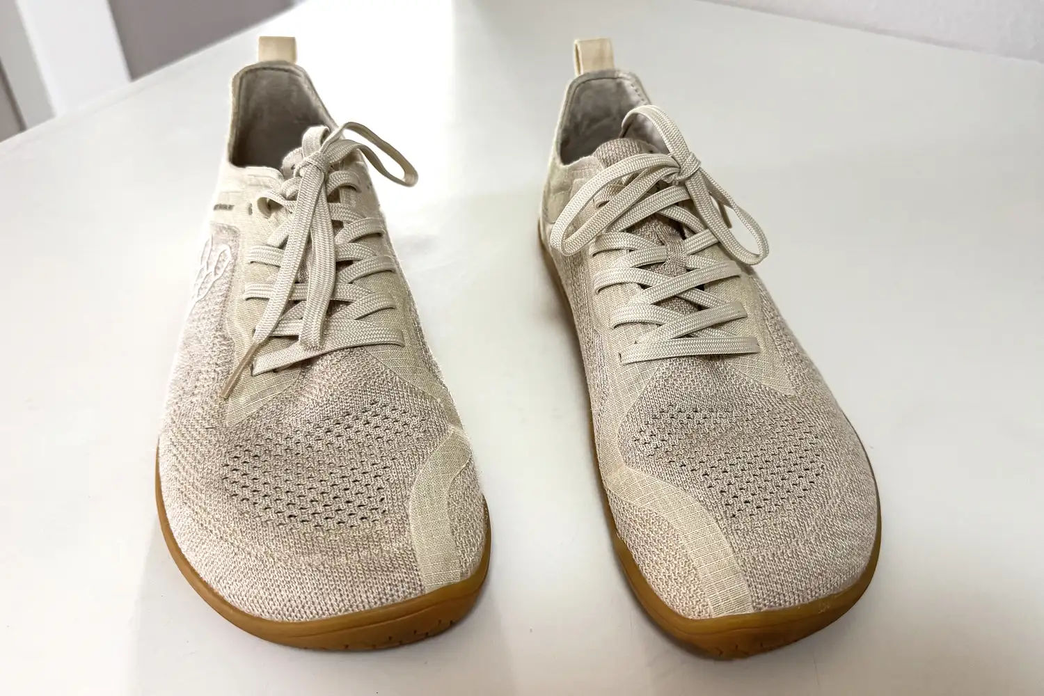 The toes on a pair of Vivobarefoot Women's Primus Lite Knit Natural Sneakers