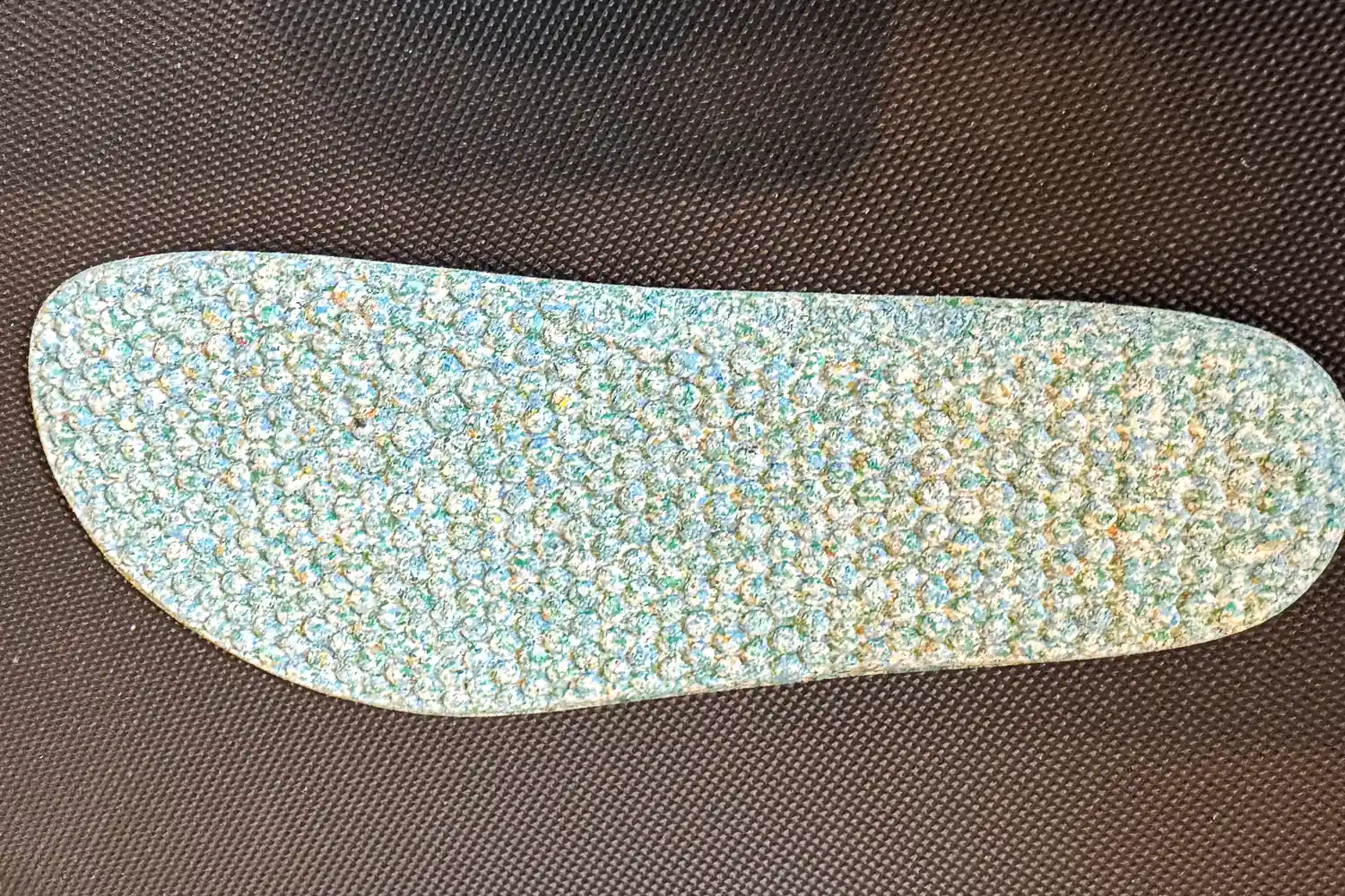 The underside of the cork insole from the Vivobarefoot Women's Primus Lite Knit Natural Sneaker