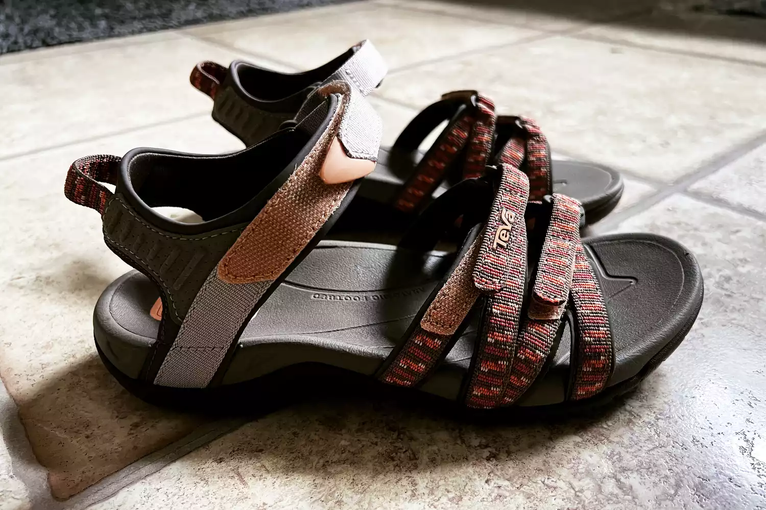 Teva Women's Tirra Sandals sitting on tile floor
