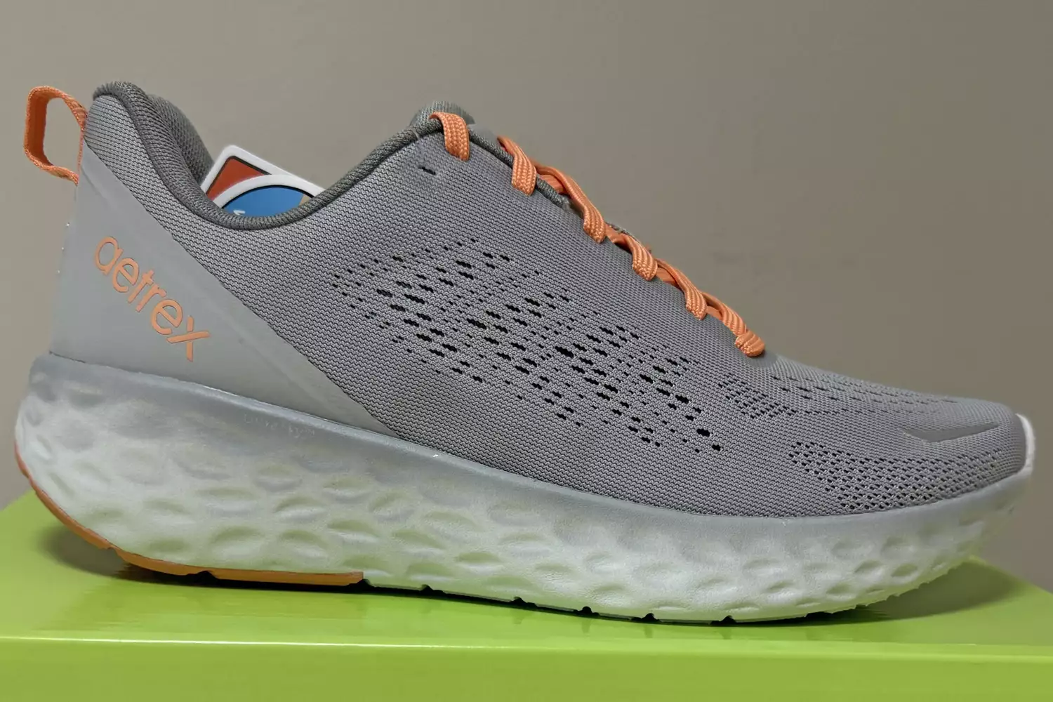 The Aetrex Danika Arch Support Sneaker on top of its box