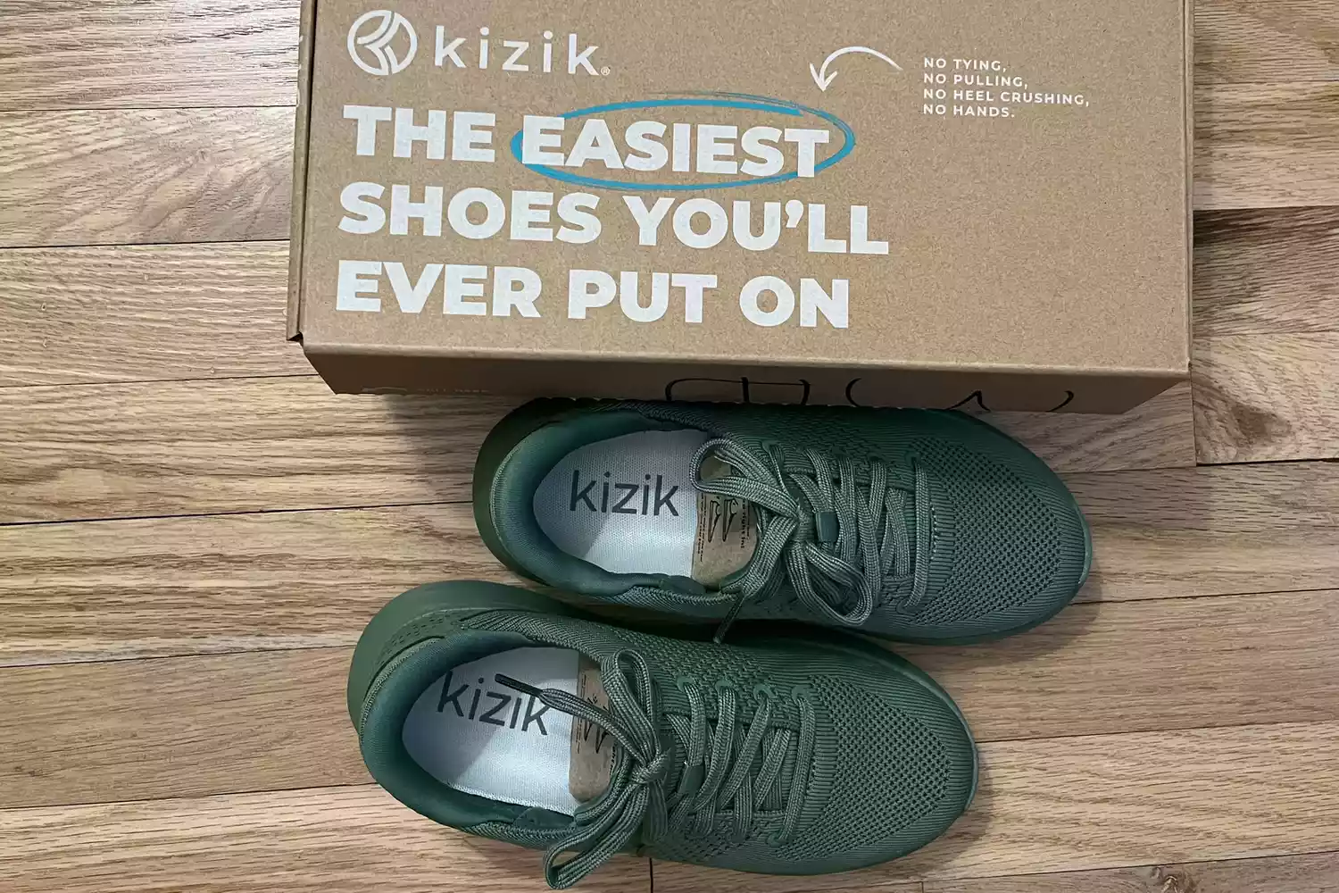 A pair of Kizik Women's Lima Shoes next to the box