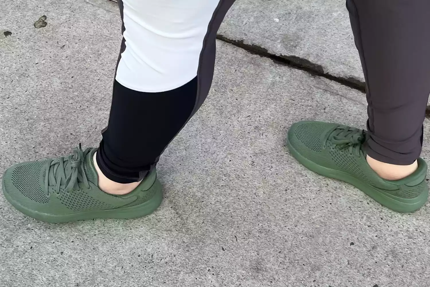 A person walks outside while wearing the Kizik Women's Lima Shoes