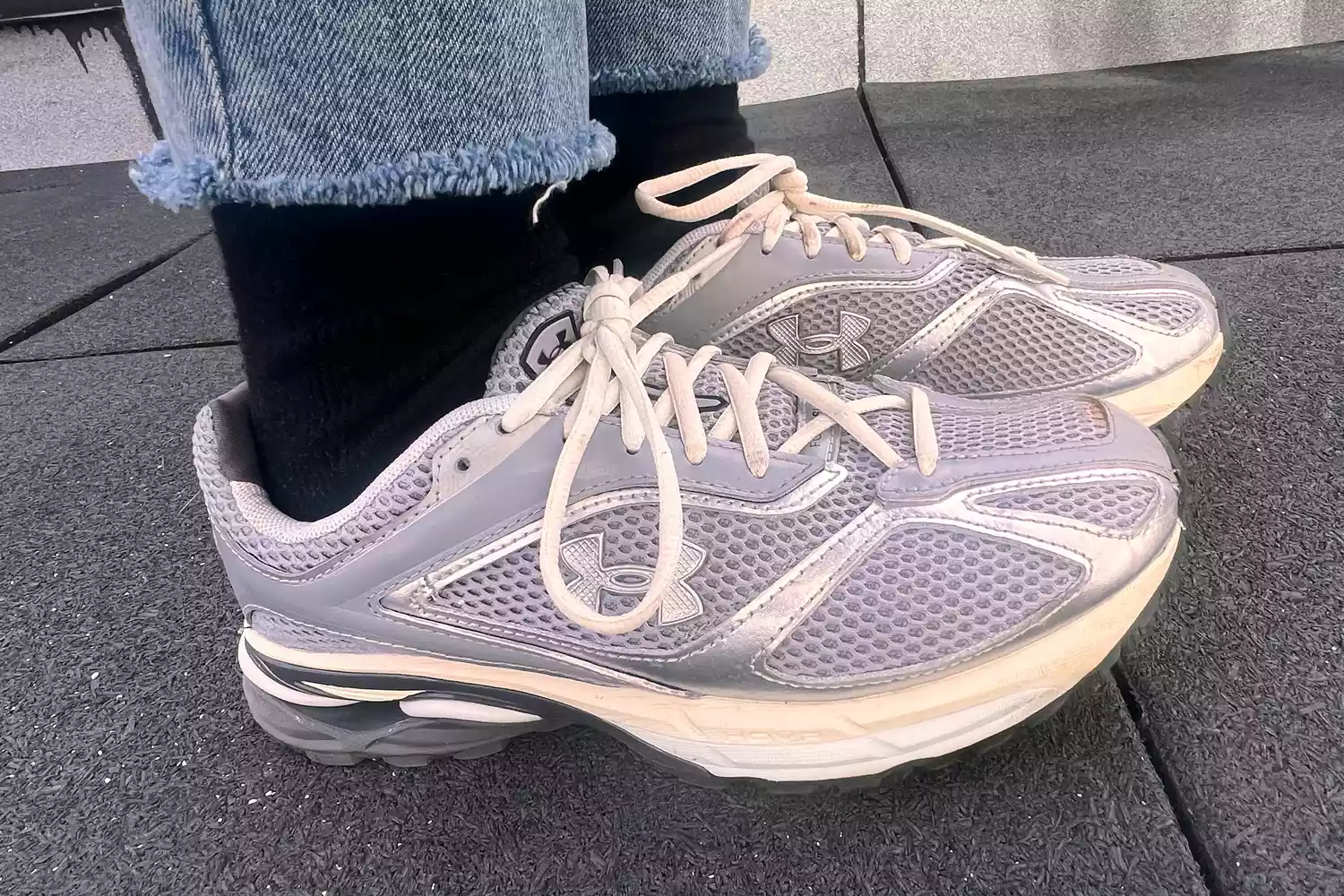 A person wears the Under Armour Unisex UA Apparition Shoes