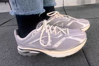 A person wears the Under Armour Unisex UA Apparition Shoes