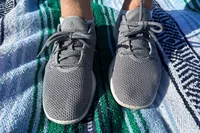 The Allbirds Tree Runners worn on a towel
