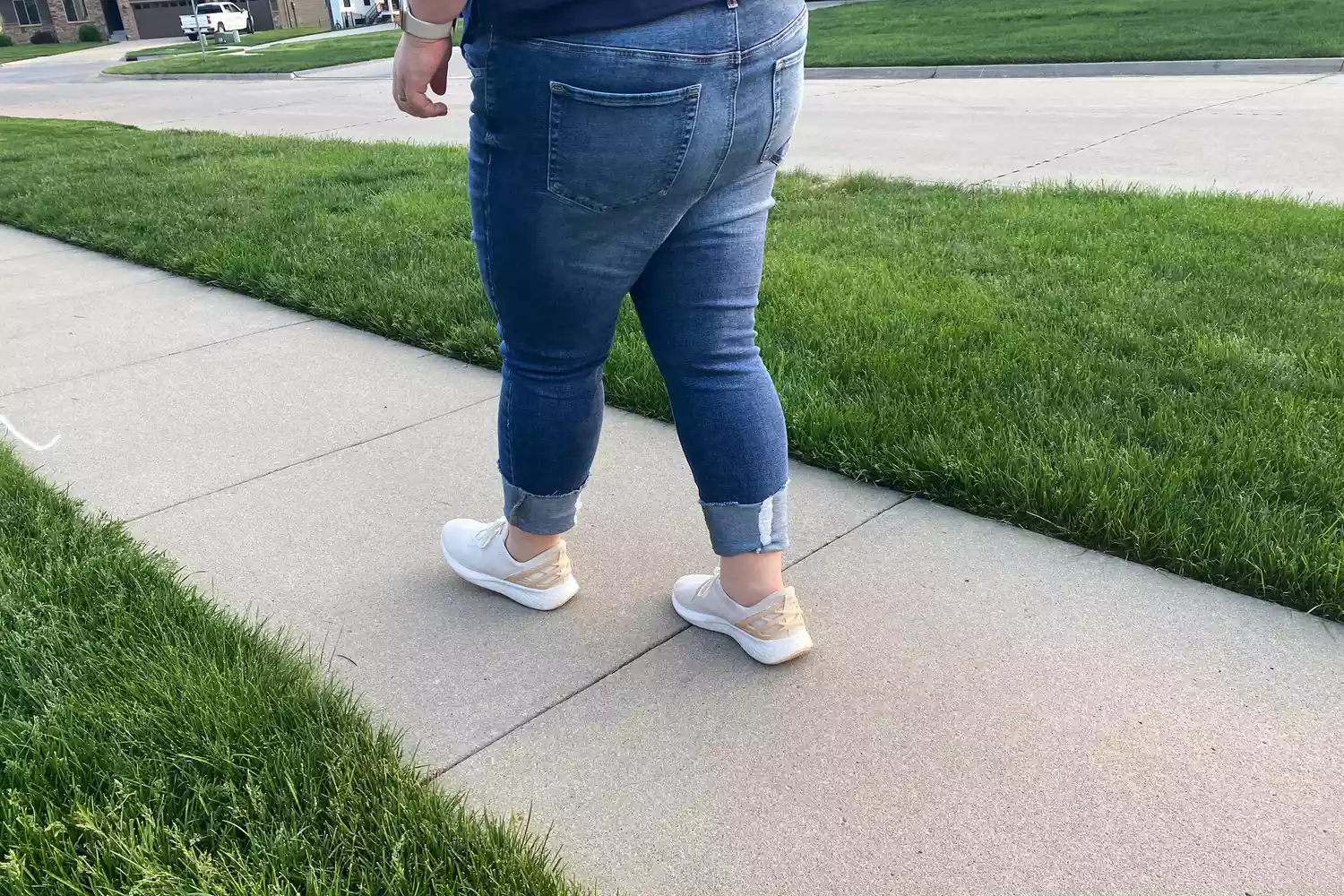 Person wearing Kizik Women's Athens Sneakers on sidewalk