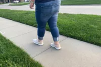 Person wearing Kizik Women's Athens Sneakers on sidewalk