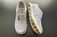 ON Cloud 5 Sneakers on black wood surface