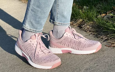 Person wearing Orthofeet Women's Kita Hands-Free Athletic Sneakers on a sidewalk