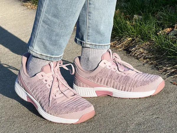 Person wearing Orthofeet Women's Kita Hands-Free Athletic Sneakers on a sidewalk