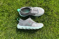 The Vionic Captivate sneakers posed in grass