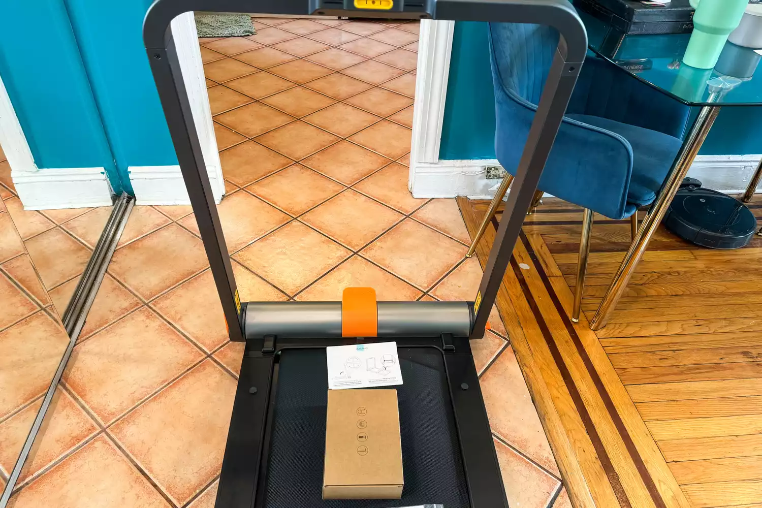 The WalkingPad MC11 Workout Treadmill on a tiled floor