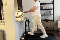A person walks on the WalkingPad R3 Hybrid Foldable Treadmill
