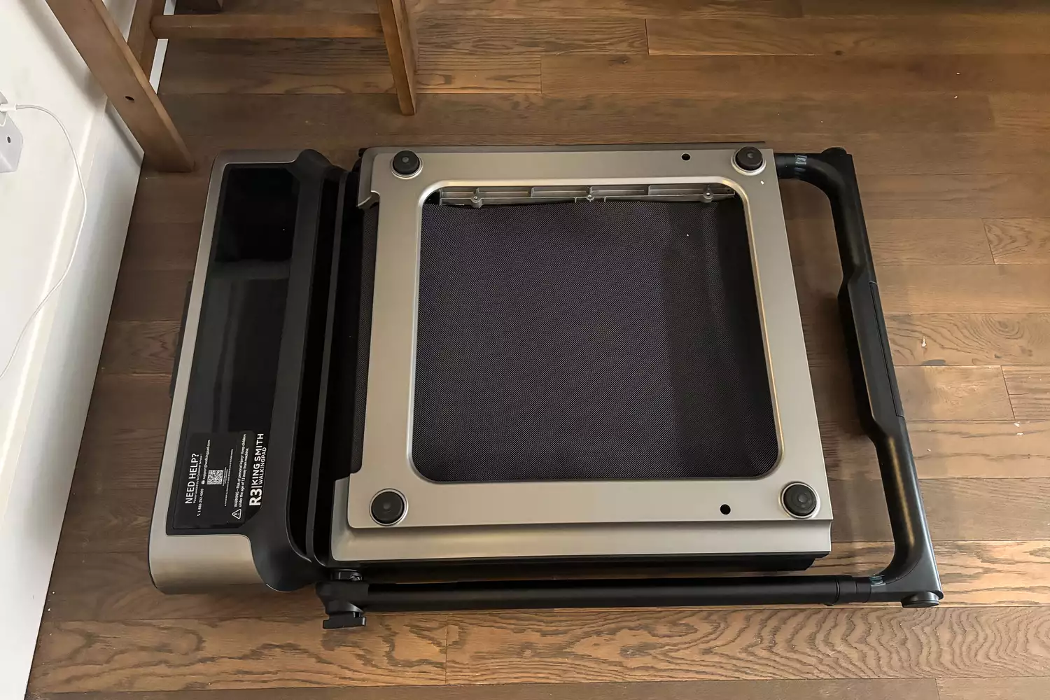 The WalkingPad R3 Hybrid Foldable Treadmill folded in half