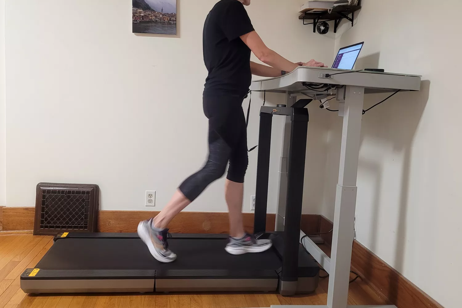 A person walks on the WalkingPad X25 Double-Fold Running Treadmill