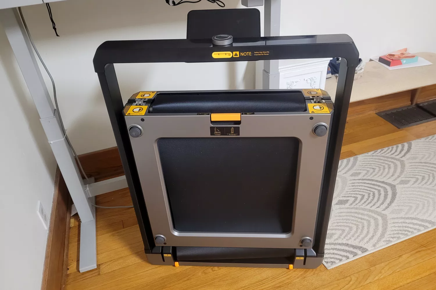 The WalkingPad X25 Double-Fold Running Treadmill folded for storage