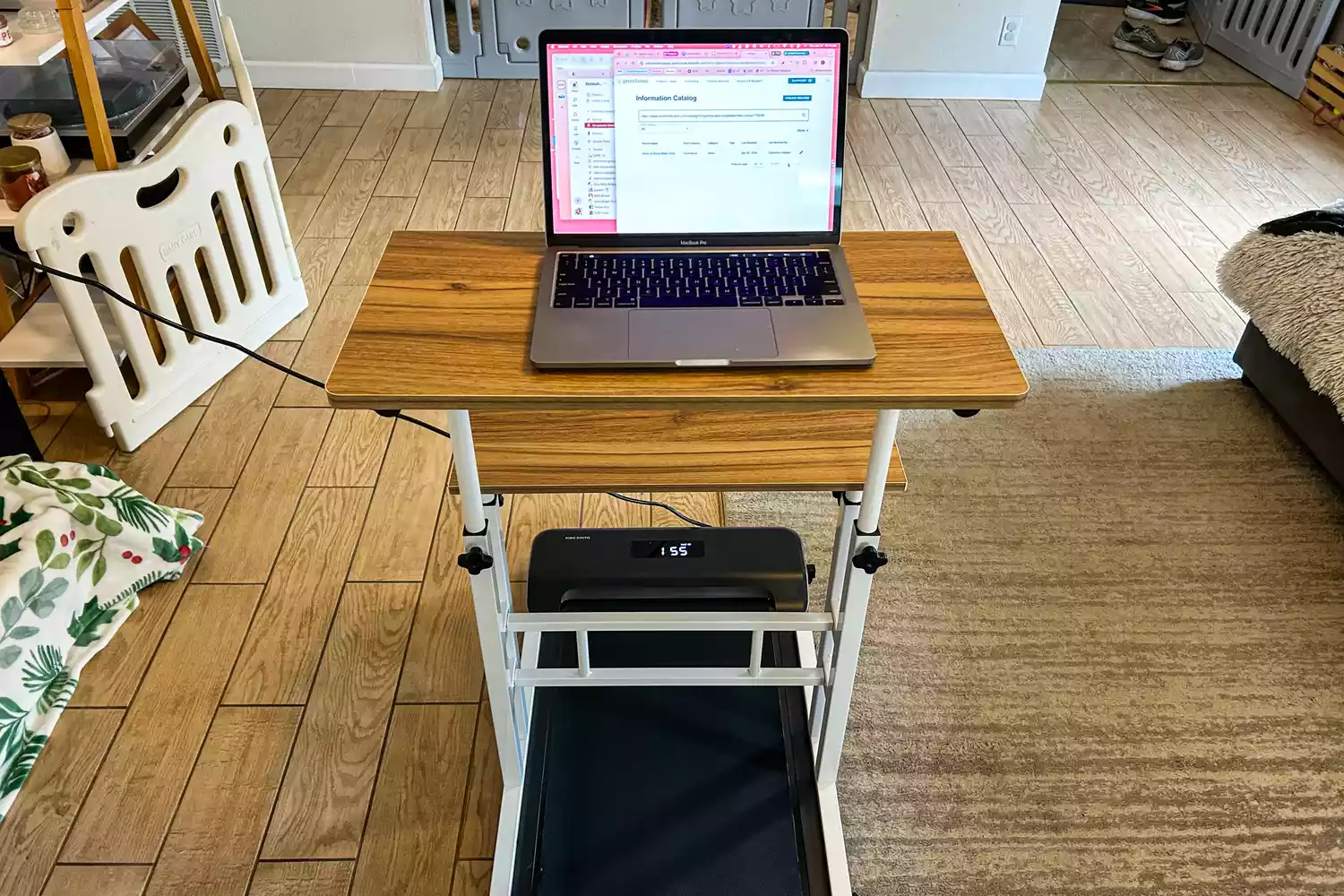 The WalkingPad Z1 Folding Under Desk Treadmill underneath a standing desk