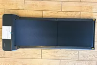 The WalkingPad Z1 Folding Under Desk Treadmill unfolded on a wooden floor
