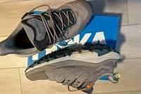 A pair of Hoka Men's Kaha 2 Low GTX Hiking Shoes on a shoebox