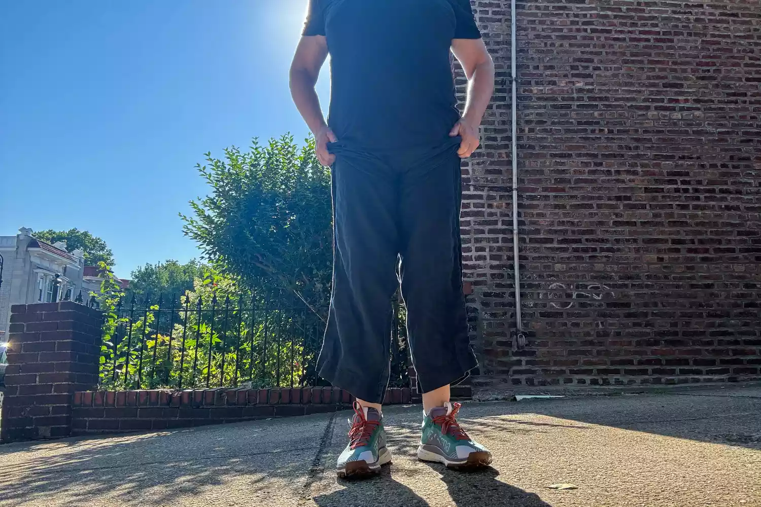 A person stands outside while wearing the Nike Women's Pegasus Trail 4 GORE-TEX Running Shoes