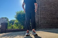 A person stands outside while wearing the Nike Women's Pegasus Trail 4 GORE-TEX Running Shoes