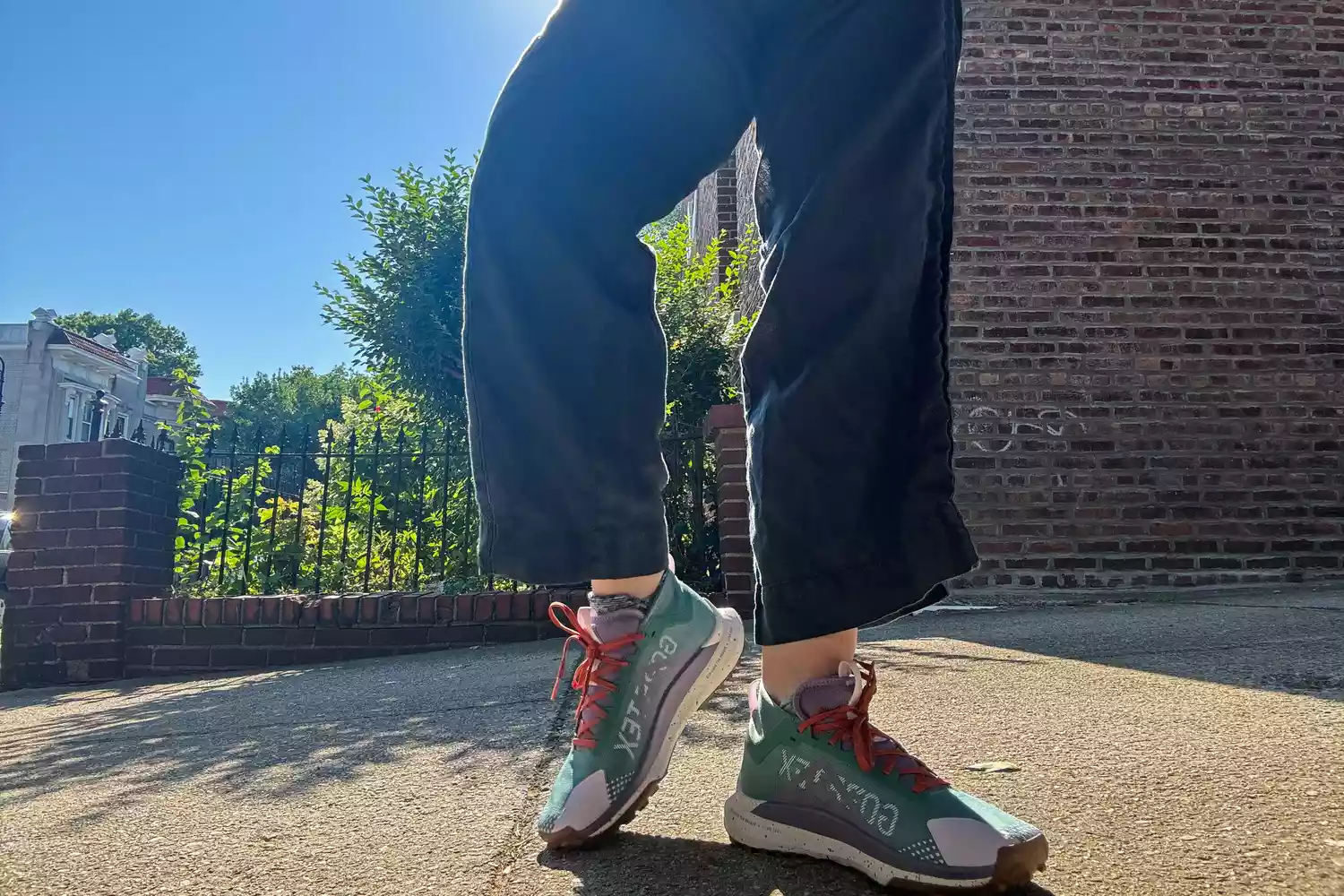 A person stands outside while wearing the Nike Women's Pegasus Trail 4 GORE-TEX Running Shoes