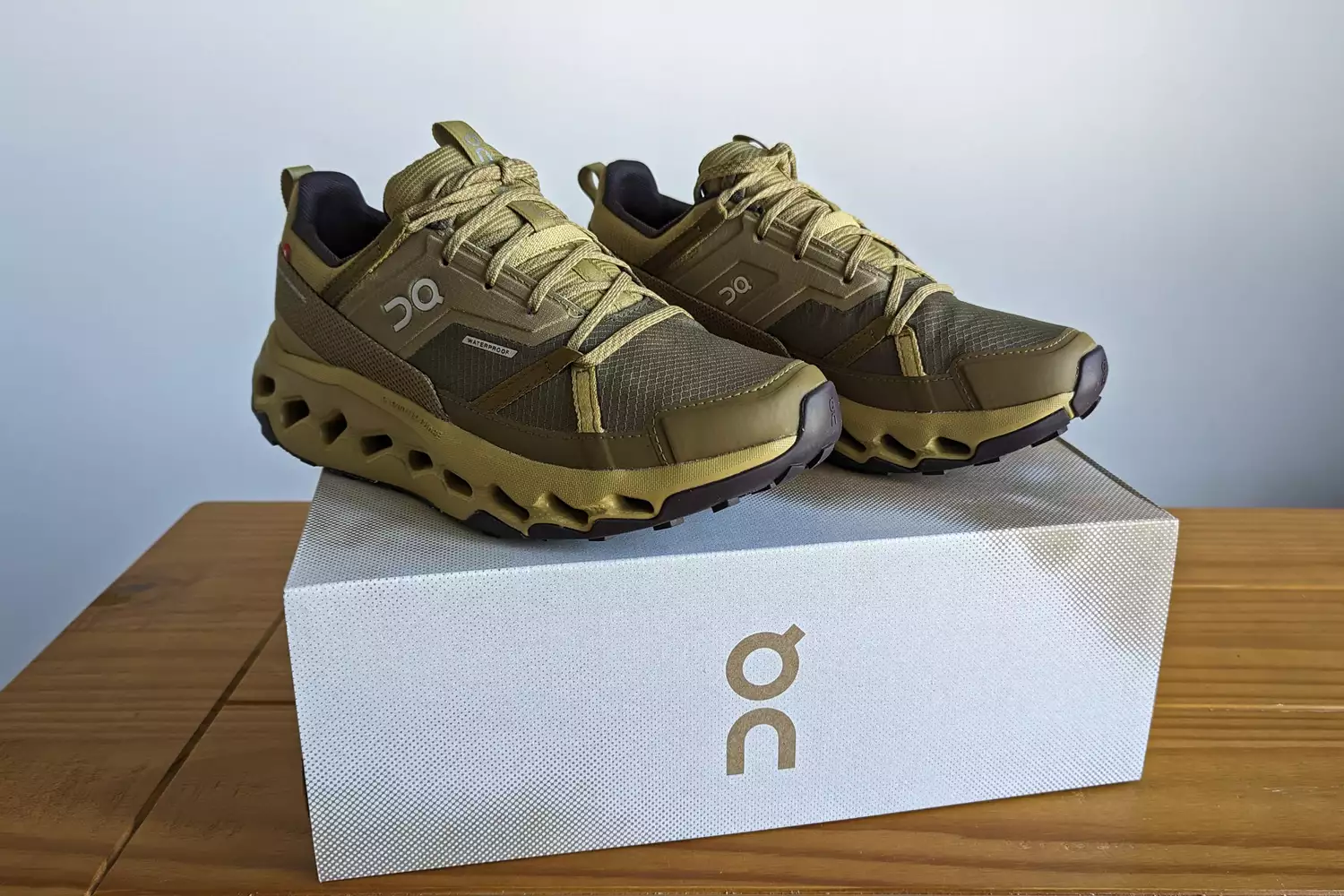 A pair of On Running Women's Cloudhorizon Waterproof Running Shoes on a shoebox