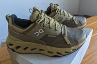 A side view of a pair of On Running Women's Cloudhorizon Waterproof Running Shoes