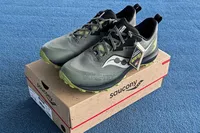 A pair of Saucony Men's Peregrine 14 GTX Waterproof Running Shoes on a shoebox
