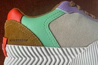 A closeup of the logo on the Sorel ONA Blvd Classic Womenâs Waterproof Sneaker