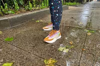 A person stands outside while wearing the Sorel ONA Blvd Classic Womenâs Waterproof Sneakers