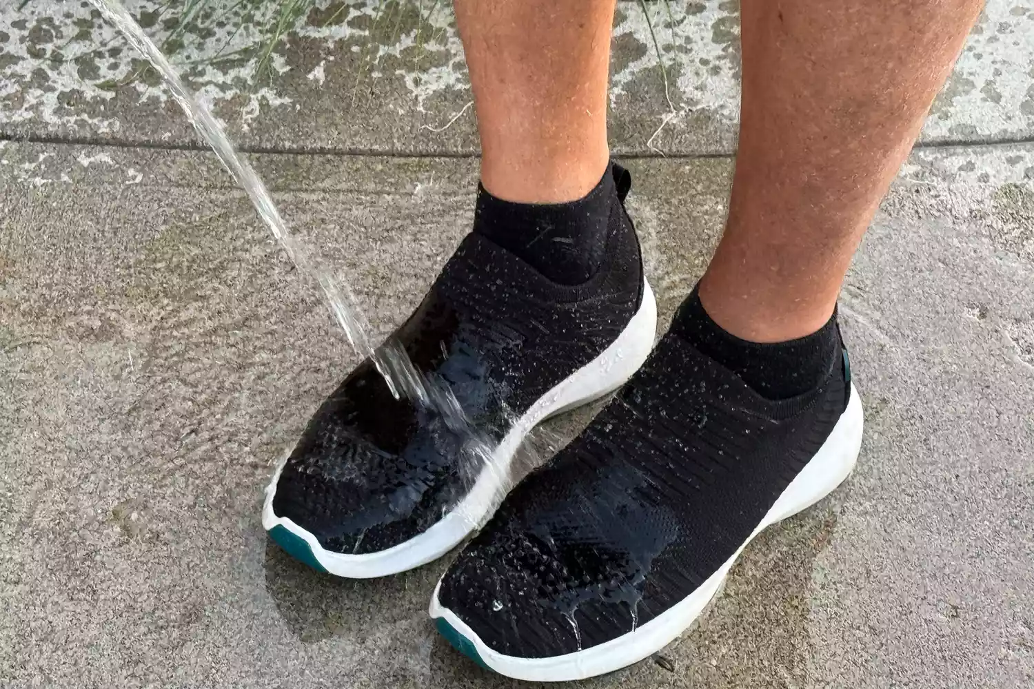 Water is poured onto the Vessi Men's Everyday Move Slip Ons