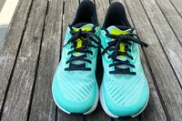 The Altra Running Experience Flow sneakers on wood