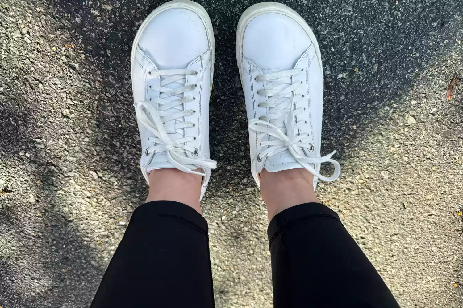 The Birkenstock Bend Low Leather Sneakers worn on blacktop