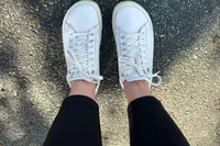 The Birkenstock Bend Low Leather Sneakers worn on blacktop