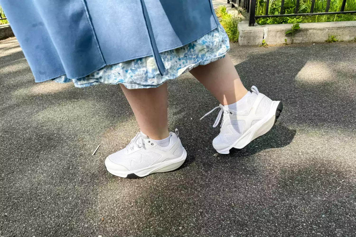 A person waling on black top in MBT Womenâs Sport 4 II shoes