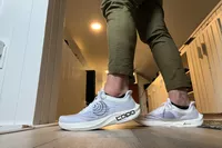 A side view of the Topo Athletic Men's Cyclone 2 on feet