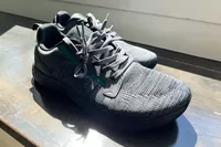 The WHITIN Men's Wide Toe Box + Zero Drop Sole Road Running Shoes on wood in sunlight