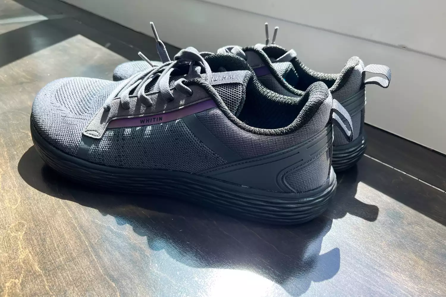 The WHITIN Men's Wide Toe Box + Zero Drop Sole Road Running Shoes on wood 