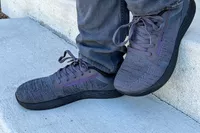 Two feet posed in the WHITIN Men's Wide Toe Box + Zero Drop Sole Road Running Shoes