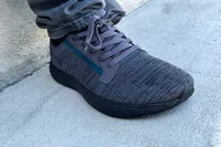 A close-up of the WHITIN Men's Wide Toe Box + Zero Drop Sole Road Running Shoe on concrete