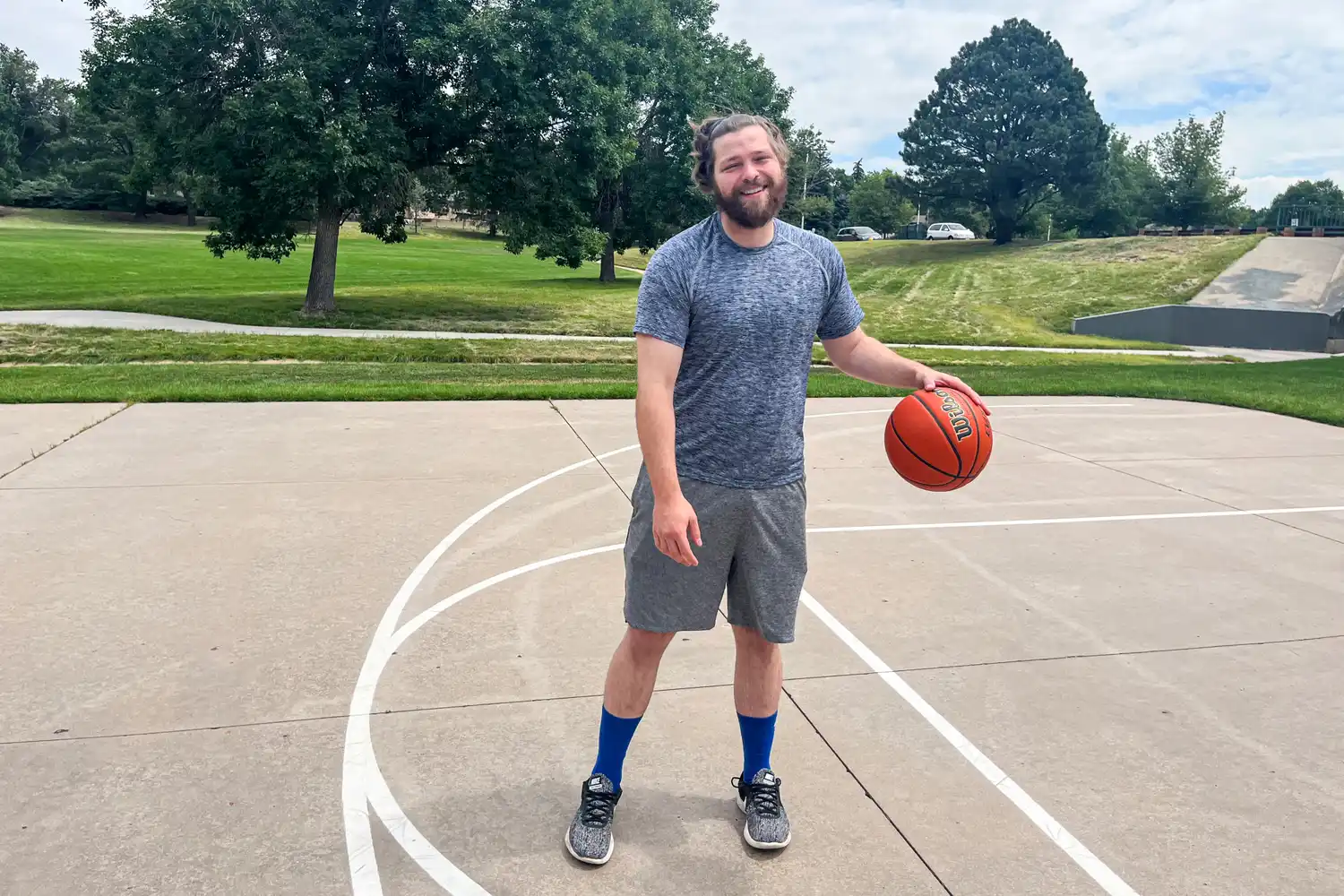 A person dribbles the Wilson Evolution Game Basketball