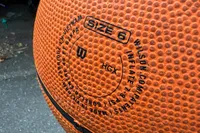 A close-up of the information printed on the Wilson NBA Authentic Outdoor Basketball