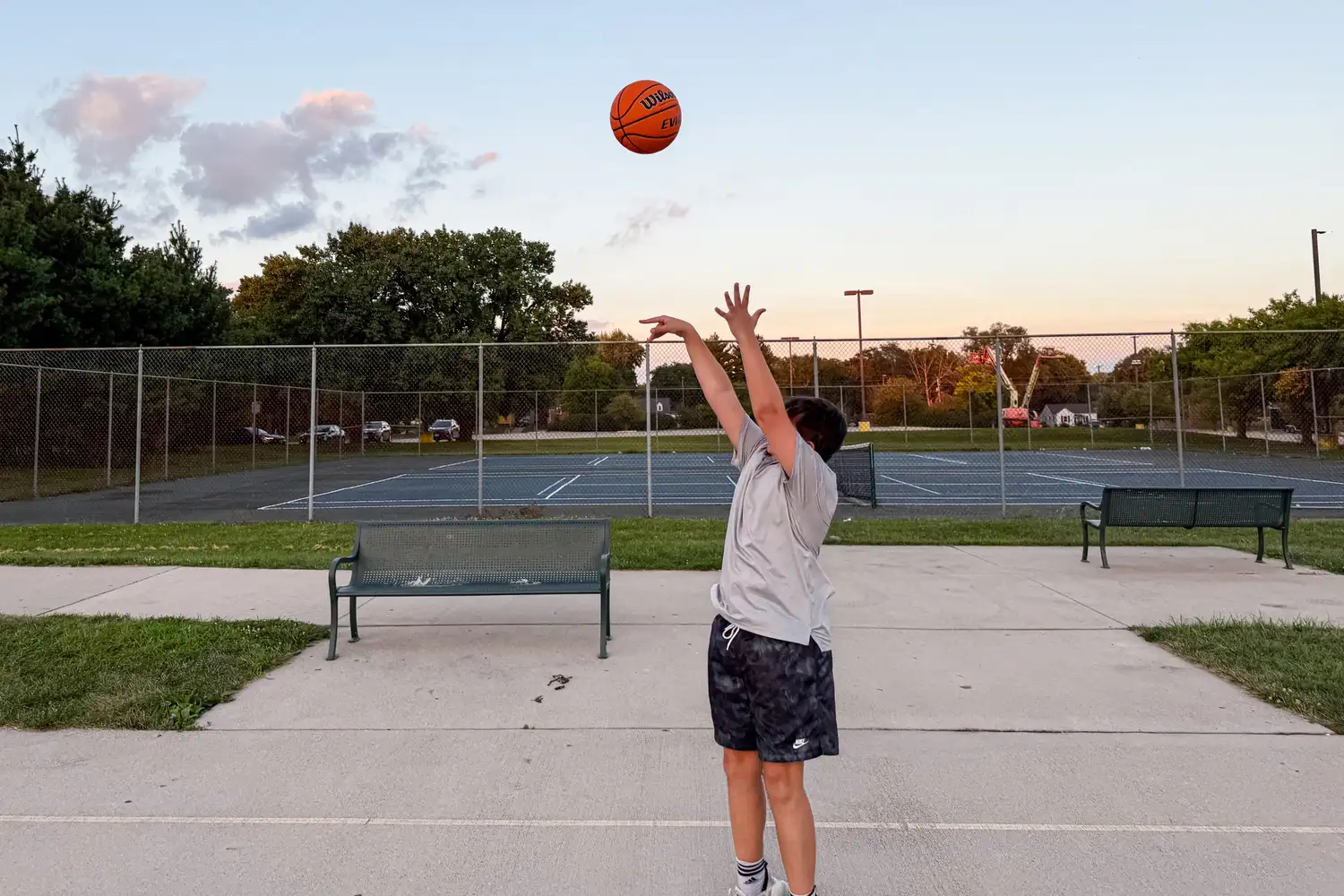 A person shoots the Wilson NCAA Evo NXT Game Basketball