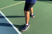 A person plays pickleball while wearing the Wilson Women's Pickle Pro Pickleball Shoes