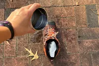 A person pours water onto the Keen Womenâs Revel IV Polar Boot
