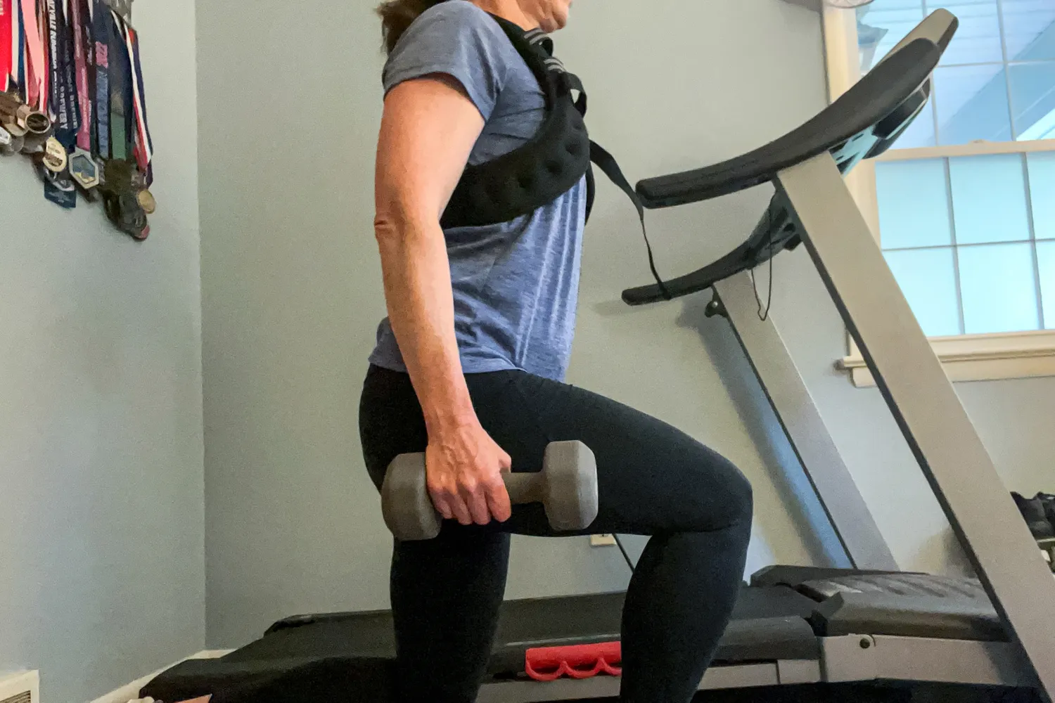 A person wears the Zelus Weighted Vest while exercising